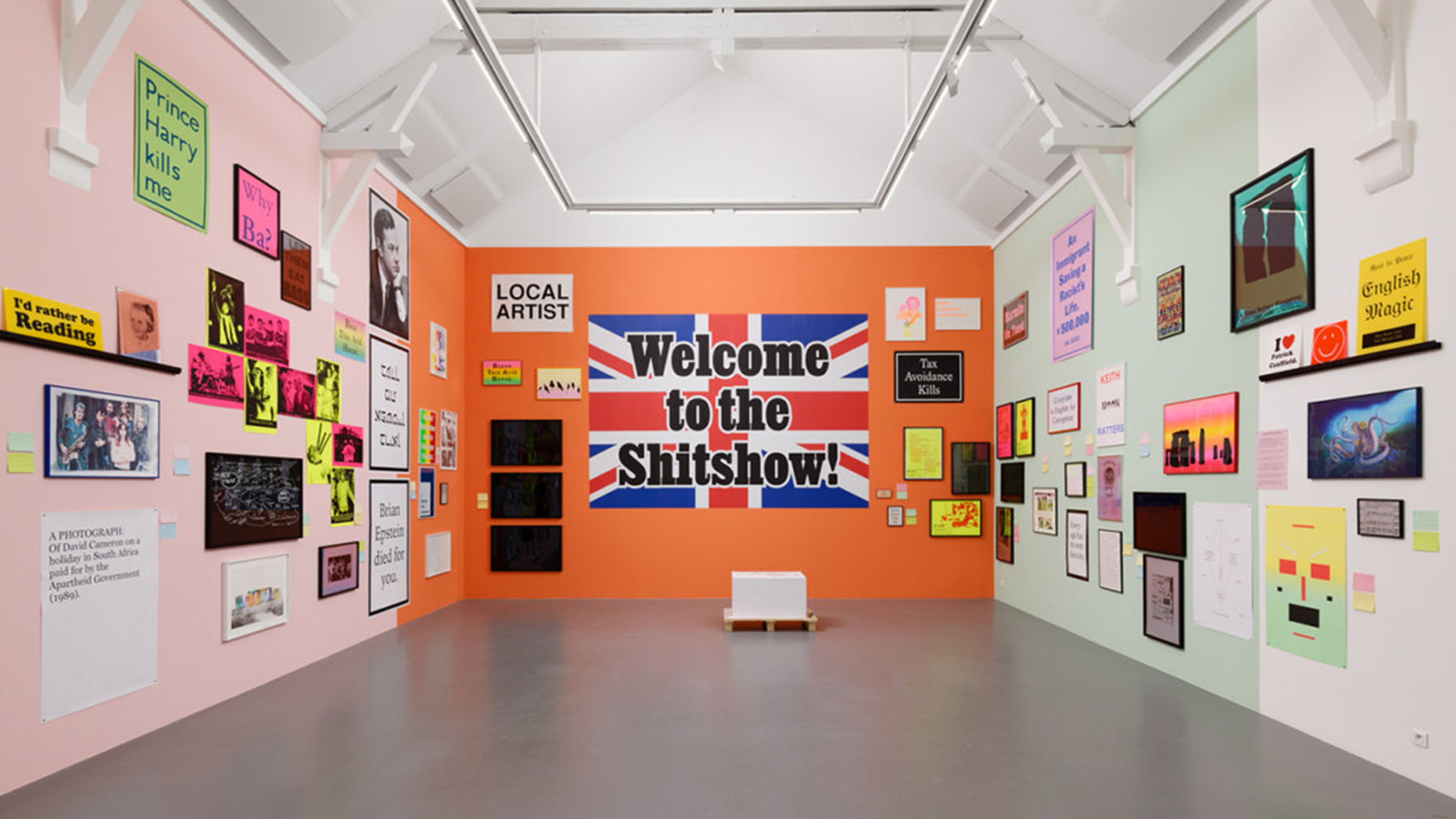 Installation view of exhibition. The centre wall has a large work that reads 'welcome to the shitshow' 